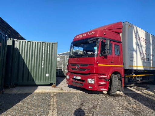 large removals lorry driving on storage depot