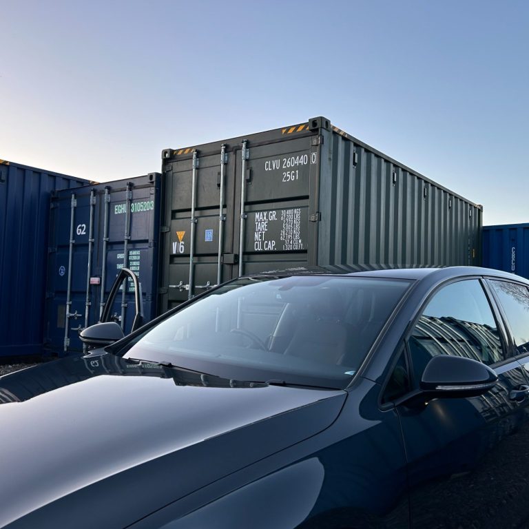 a car about to unload contents into a shipping container