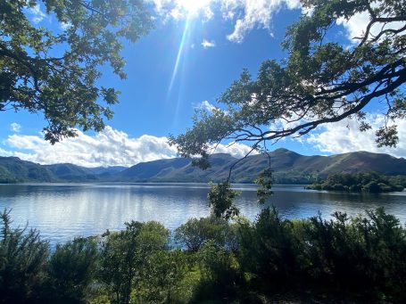 lake scene in summer showing mountains in cumbria