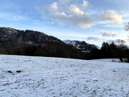 hills in cumbria with snow on ground