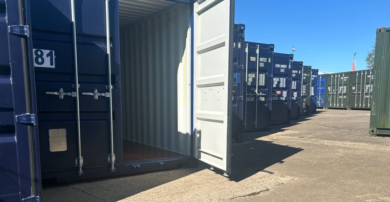 Open shipping container among multiple shipping containers used for self storage purposes.
