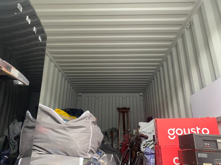 shipping storage unit with boxes and furniture inside it