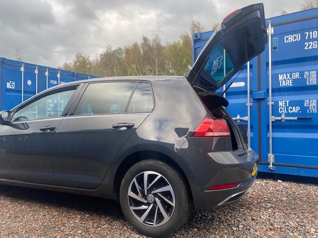 family car with boot open ready to place goods into a storage unit