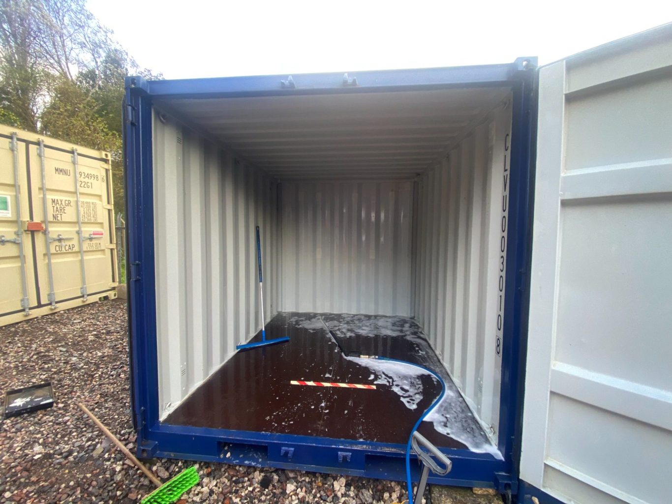 the inside of a container unit being washed