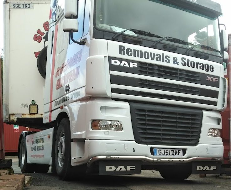 a large removal vehicle driving onto a self storage facility