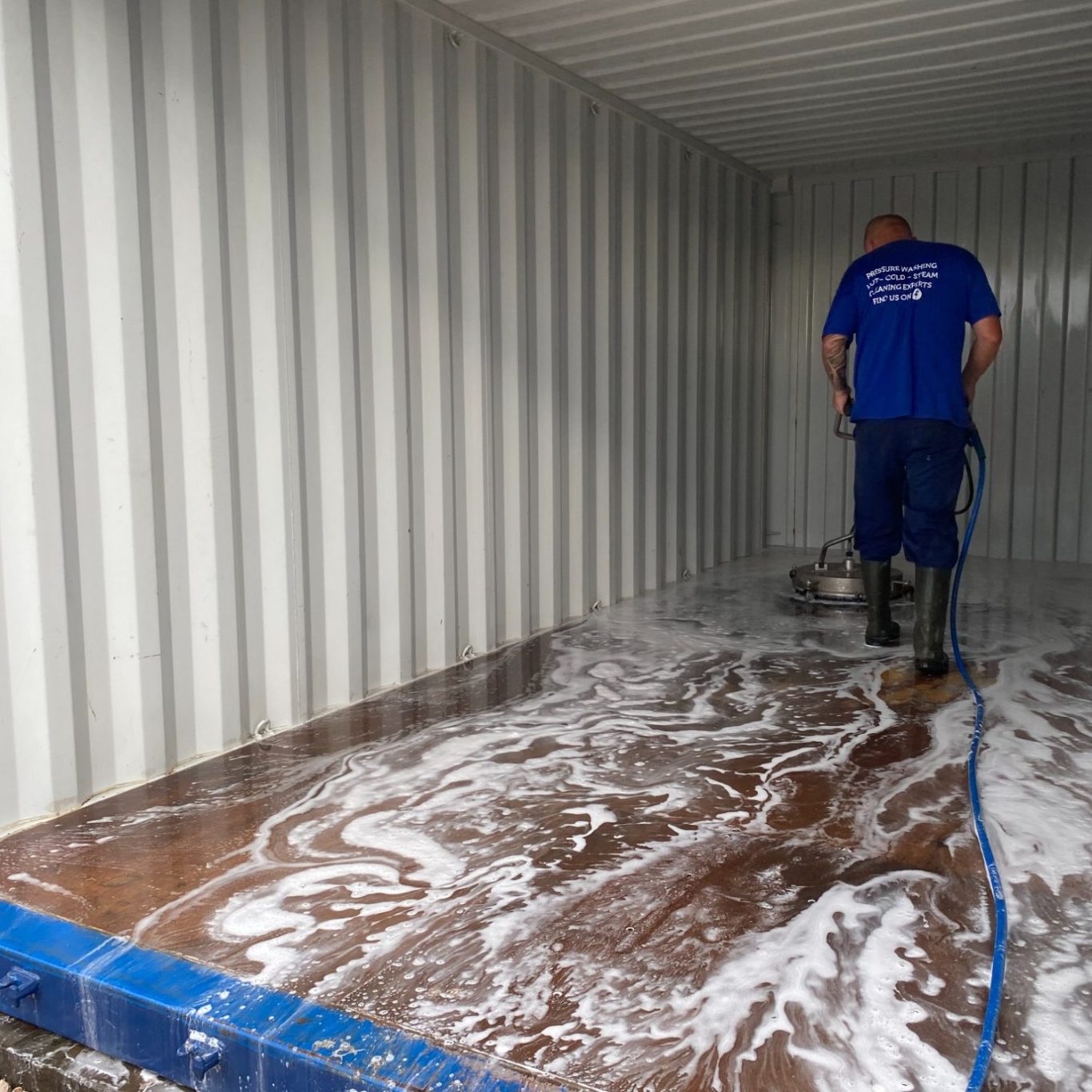 inside a storage unit being pressure washed