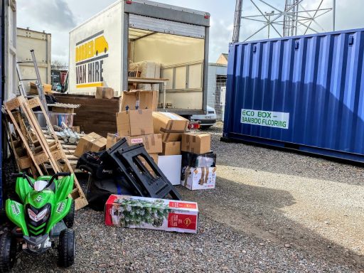 contents of furniture on the ground next to a storage unit