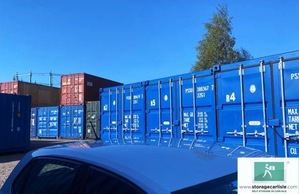 a row of shipping containers on a sunny day
