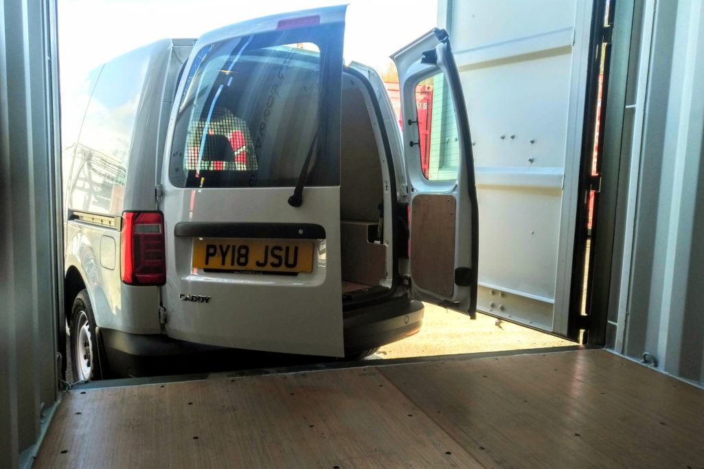 van unloading contents into storage unit