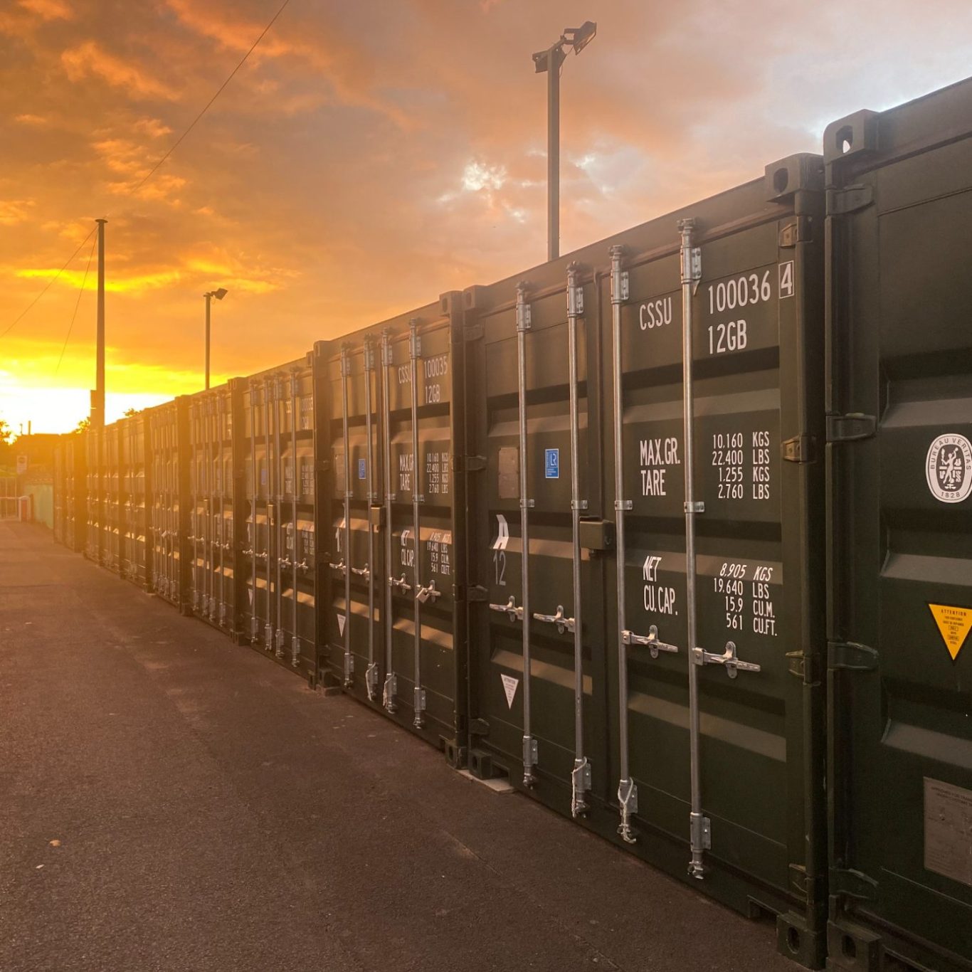 shipping container storage units at sunset