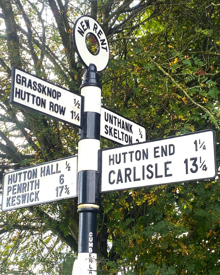 road sign pointing to Carlisle in Cumbria