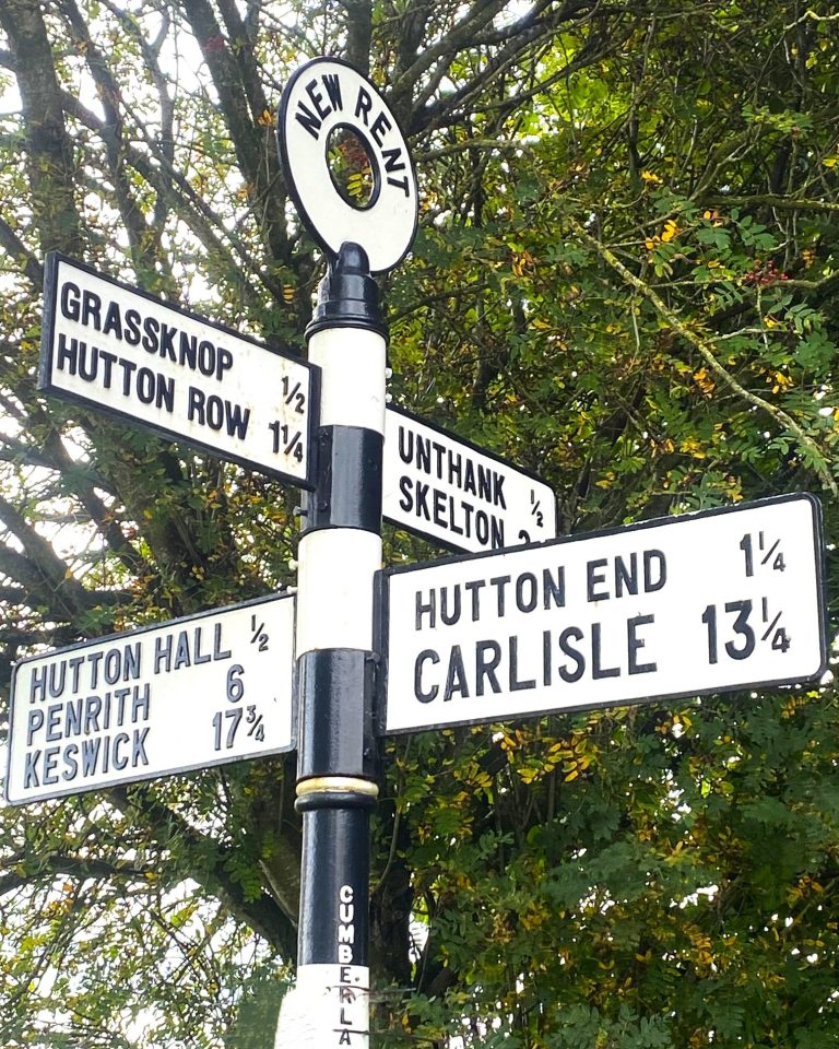 road sign pointing to Carlisle in Cumbria