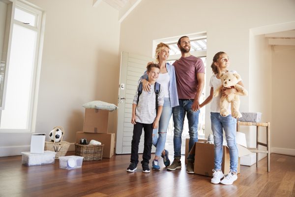 happy family that are moving contents into their new home