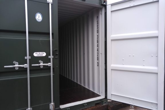 green one trip 20 foot ISO shipping container with door open