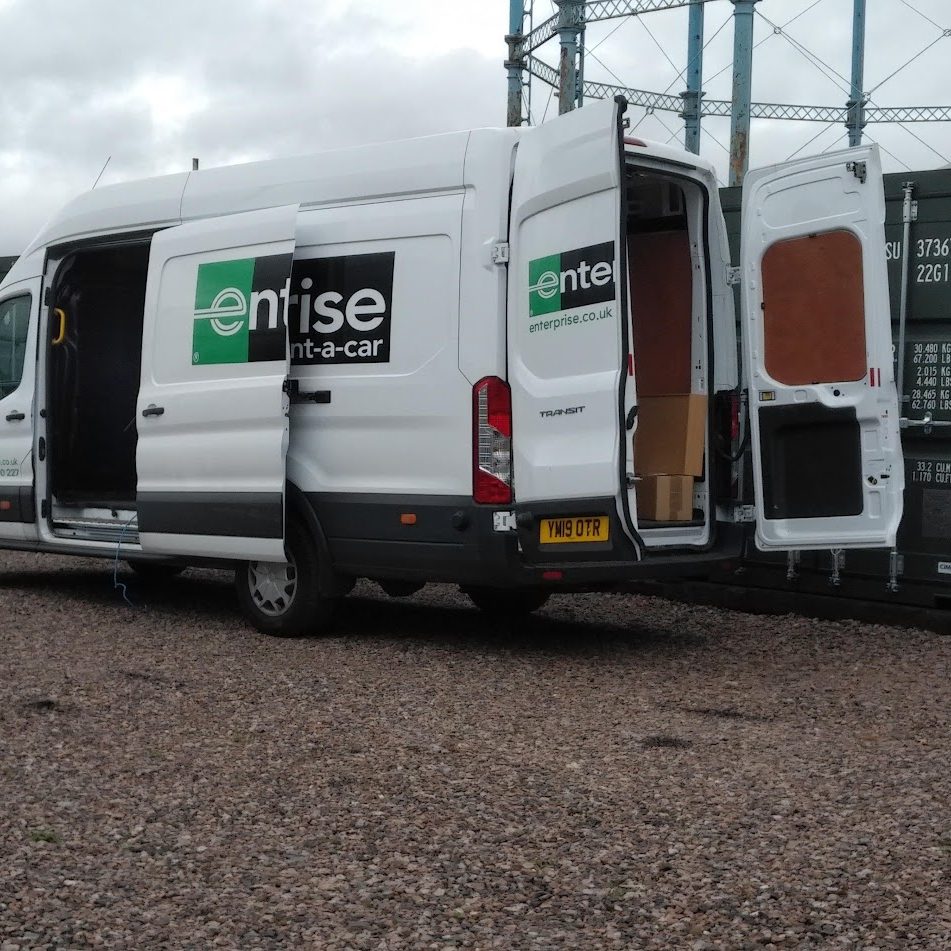 van delivering furniture into a storage facility