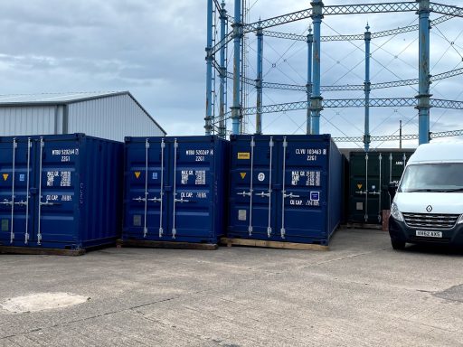 row of storage units next to a gasholder