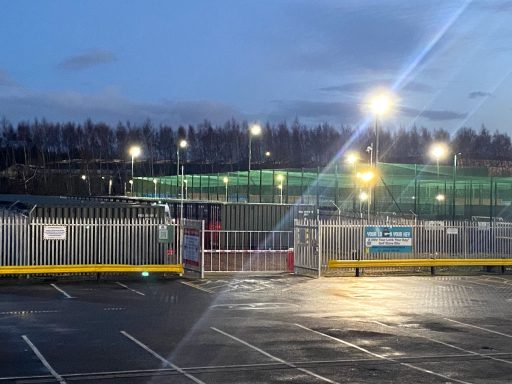 entrance to illuminated self storage facility at night