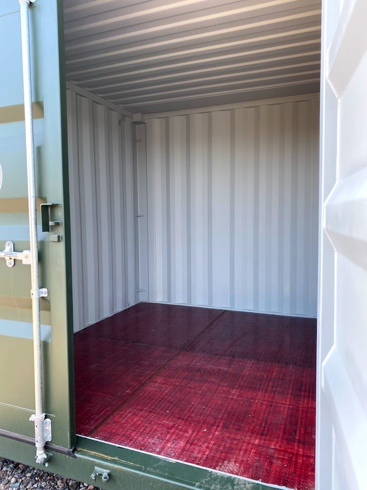 inside of a 10 foot shipping container with red floor