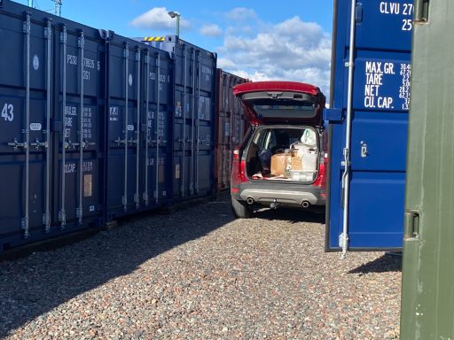 car unloading into a storage unit