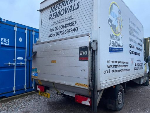 van unloading into a shipping container