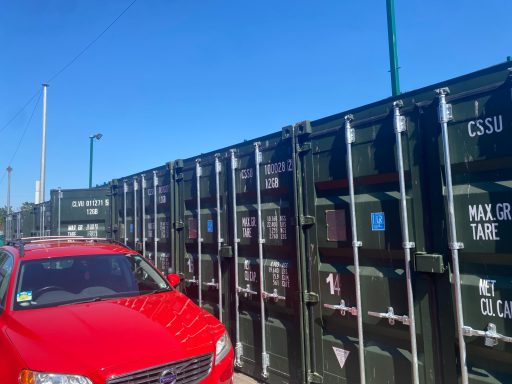 car at a shipping container