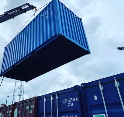 shipping container in the air on a crane