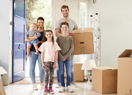 happy family just moving into a new home