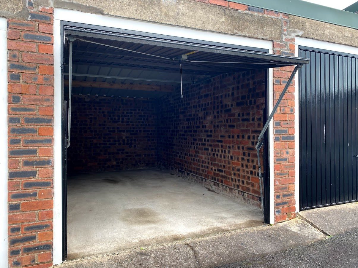 a lock up garage with door open