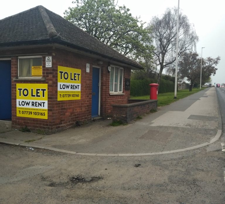 the front view of a commercial storage building