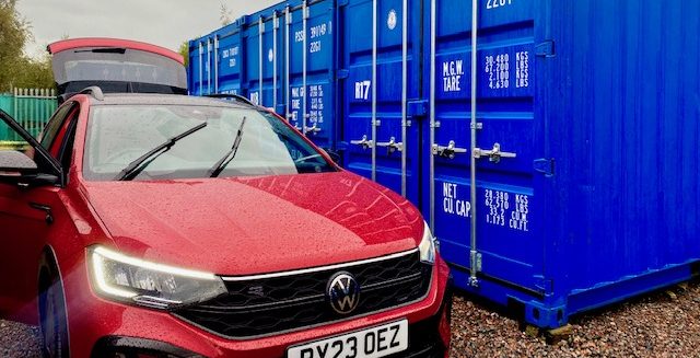 car unloading contents into a storage unit