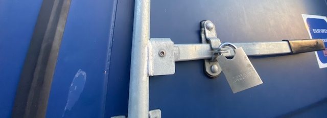 a heavy duty padlock on a shipping container