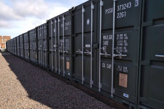 row of green storage units