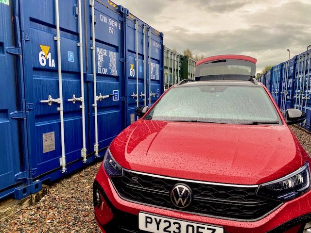 vehicle about to unload next to a storage unit