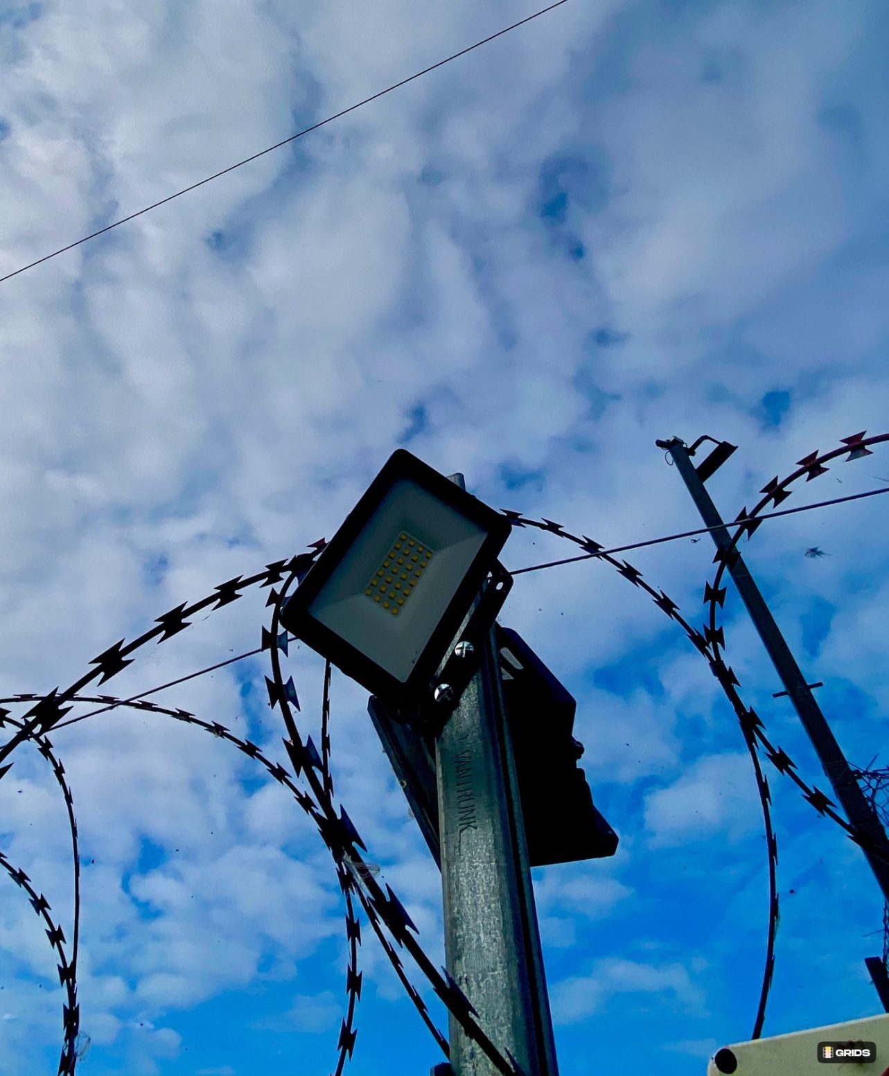 storage compound LED floodlight and razor wire security