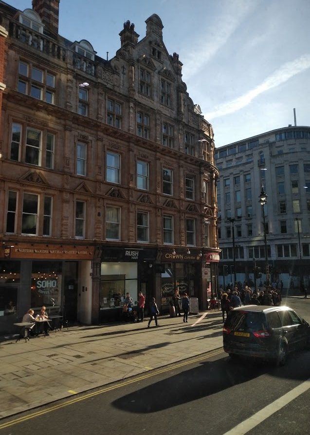 busy street scene with tall buildings