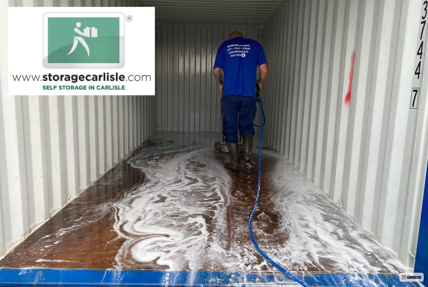 shipping container being pressure cleaned