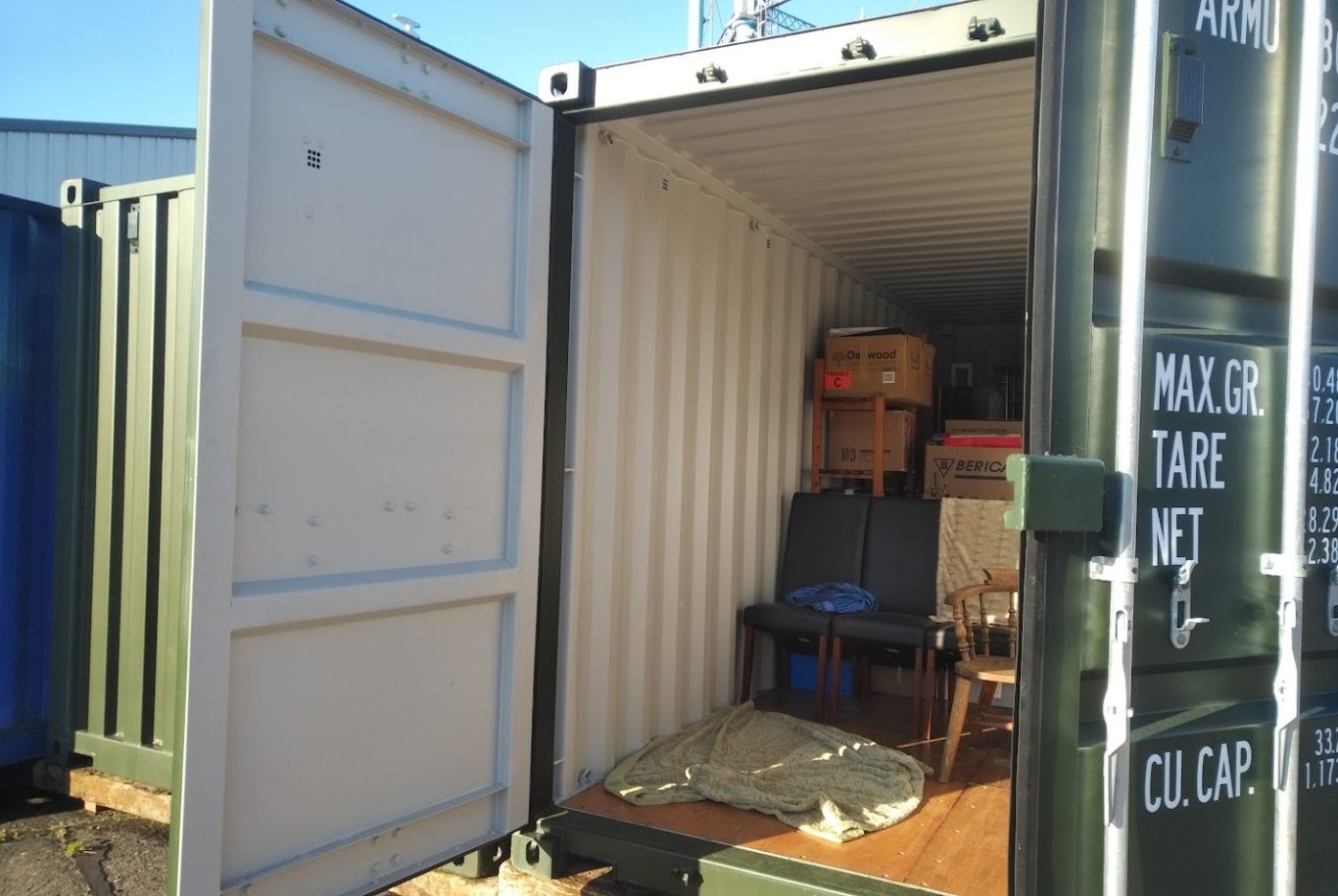 household furniture sitting inside a storage locker unit